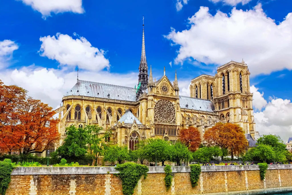 Notre-Dame de Paris with its restored spire seen from the garden behind the apse